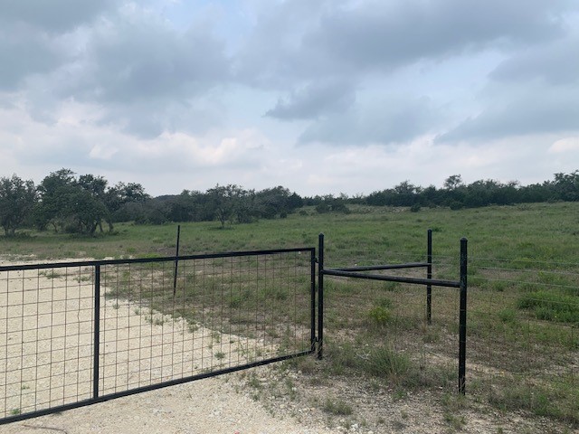 2993 Pump Station Road Wimberley, TX 78676 - Photo 2 of 21 a view of a lake from a yard