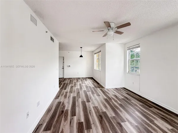 a view of an empty room with a window