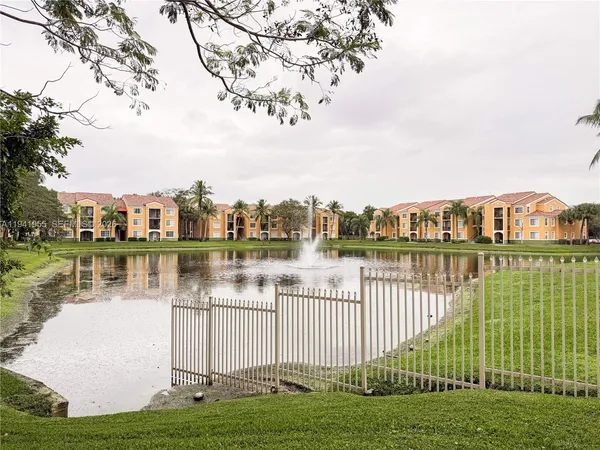a view of a lake with a garden
