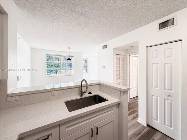 a bathroom with a sink and a window