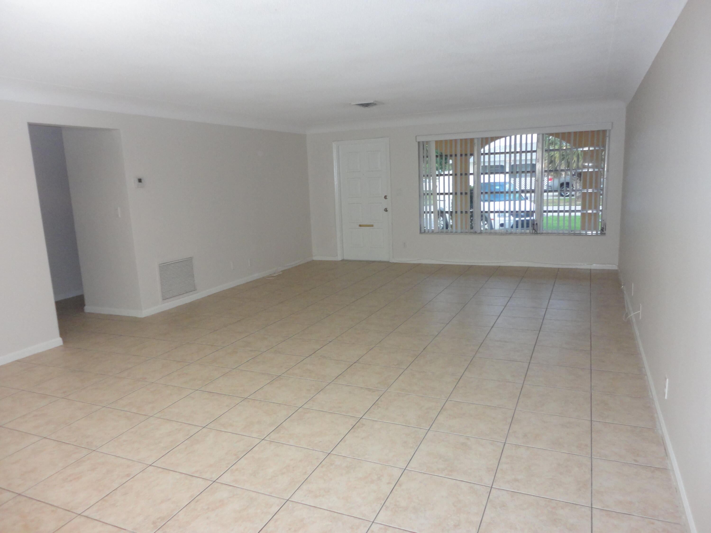 500 Northeast 28th Street Boca Raton, FL 33431 - Photo 6 of 10 a view of an empty room with a window