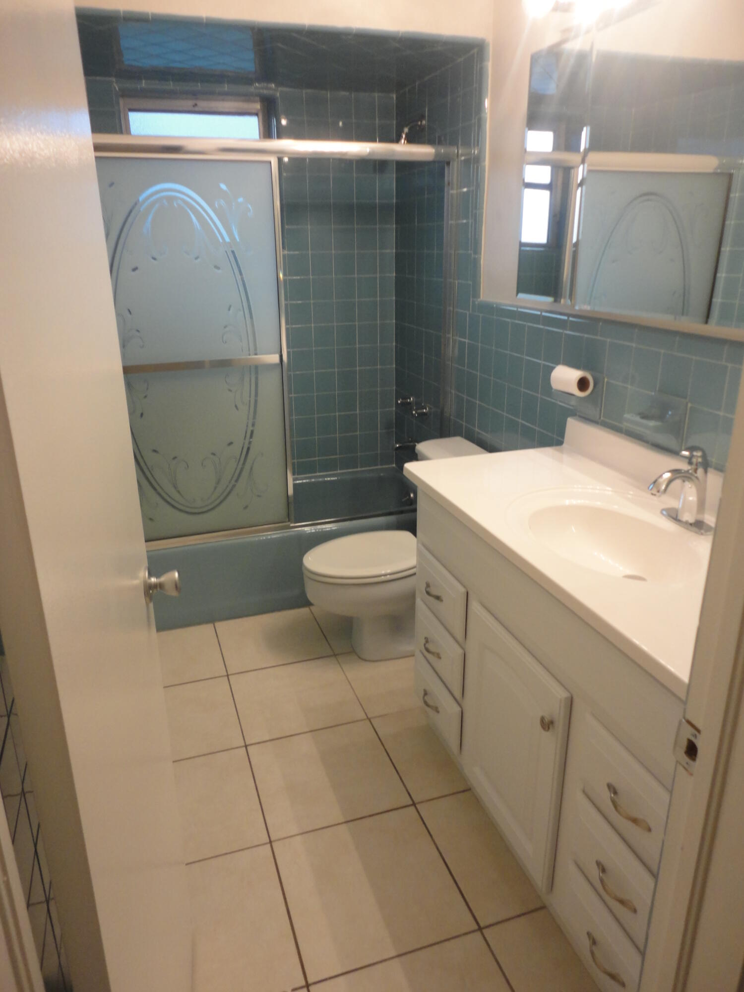 500 Northeast 28th Street Boca Raton, FL 33431 - Photo 7 of 10 a bathroom with a sink a toilet and a mirror