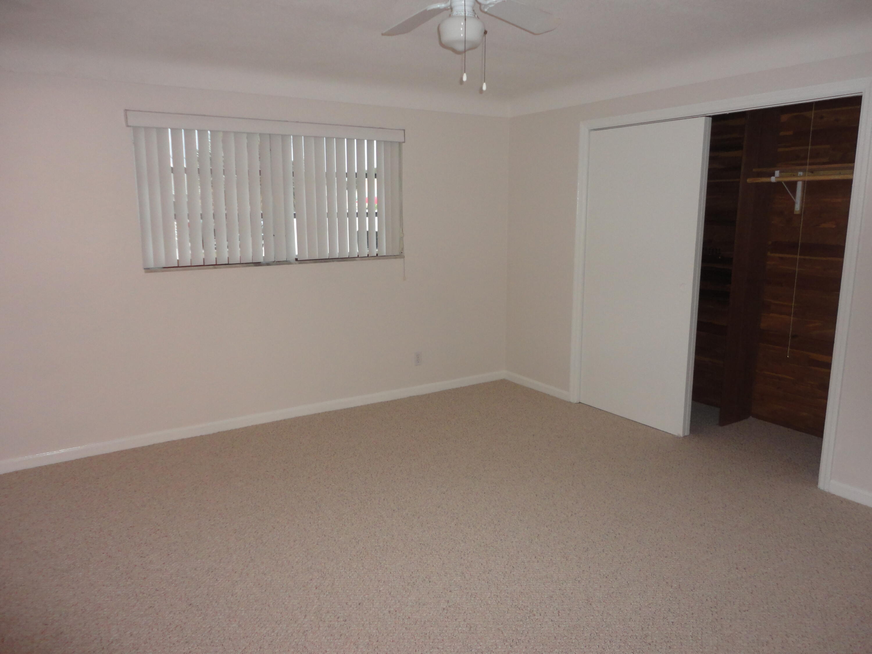 500 Northeast 28th Street Boca Raton, FL 33431 - Photo 9 of 10 an empty room with windows and closet