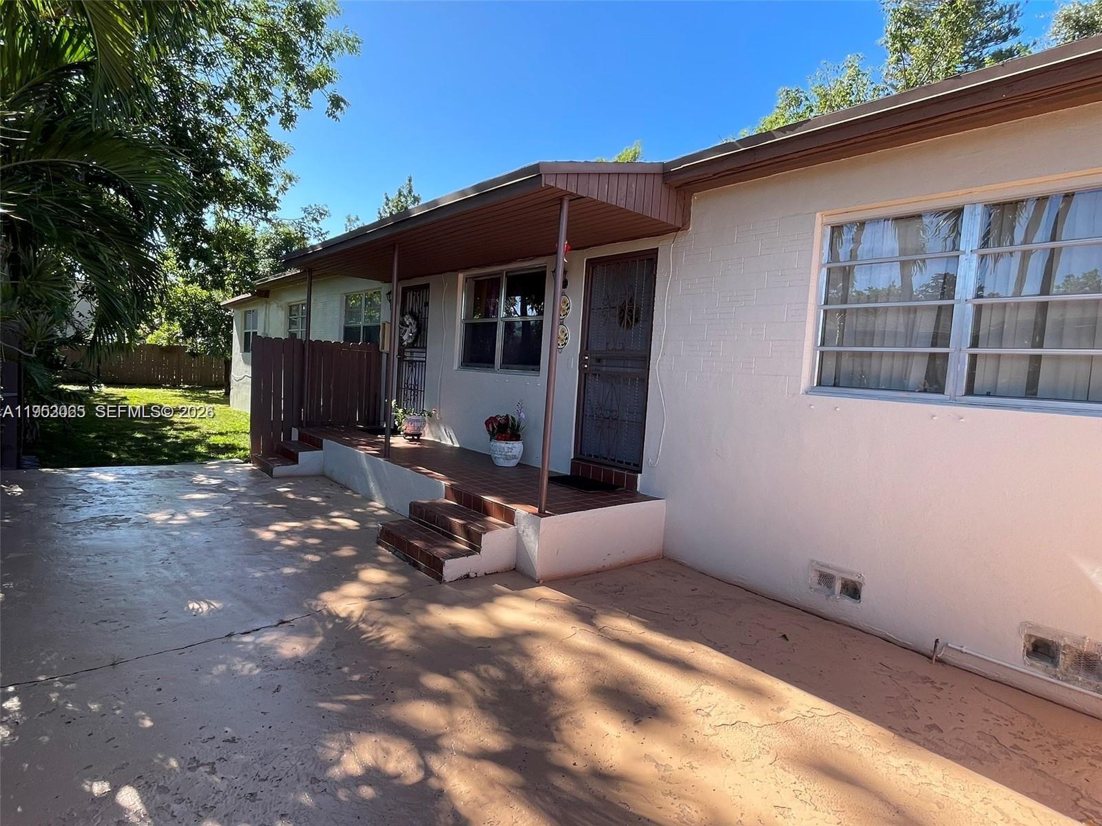 1790 Northwest 19th Street Miami, FL 33125 - Photo 3 of 6 a view of a house with backyard and sitting area