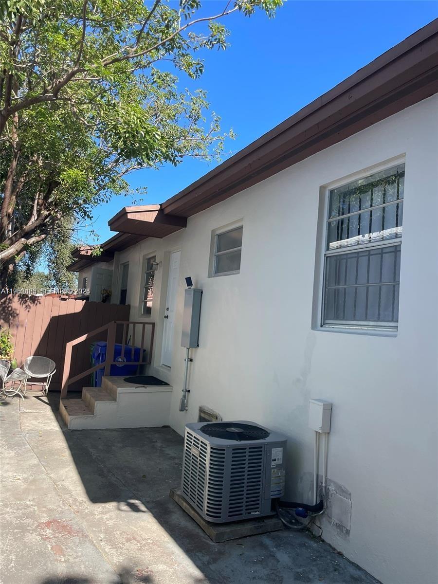 1790 Northwest 19th Street Miami, FL 33125 - Photo 4 of 6 a view of a house with backyard and sitting area
