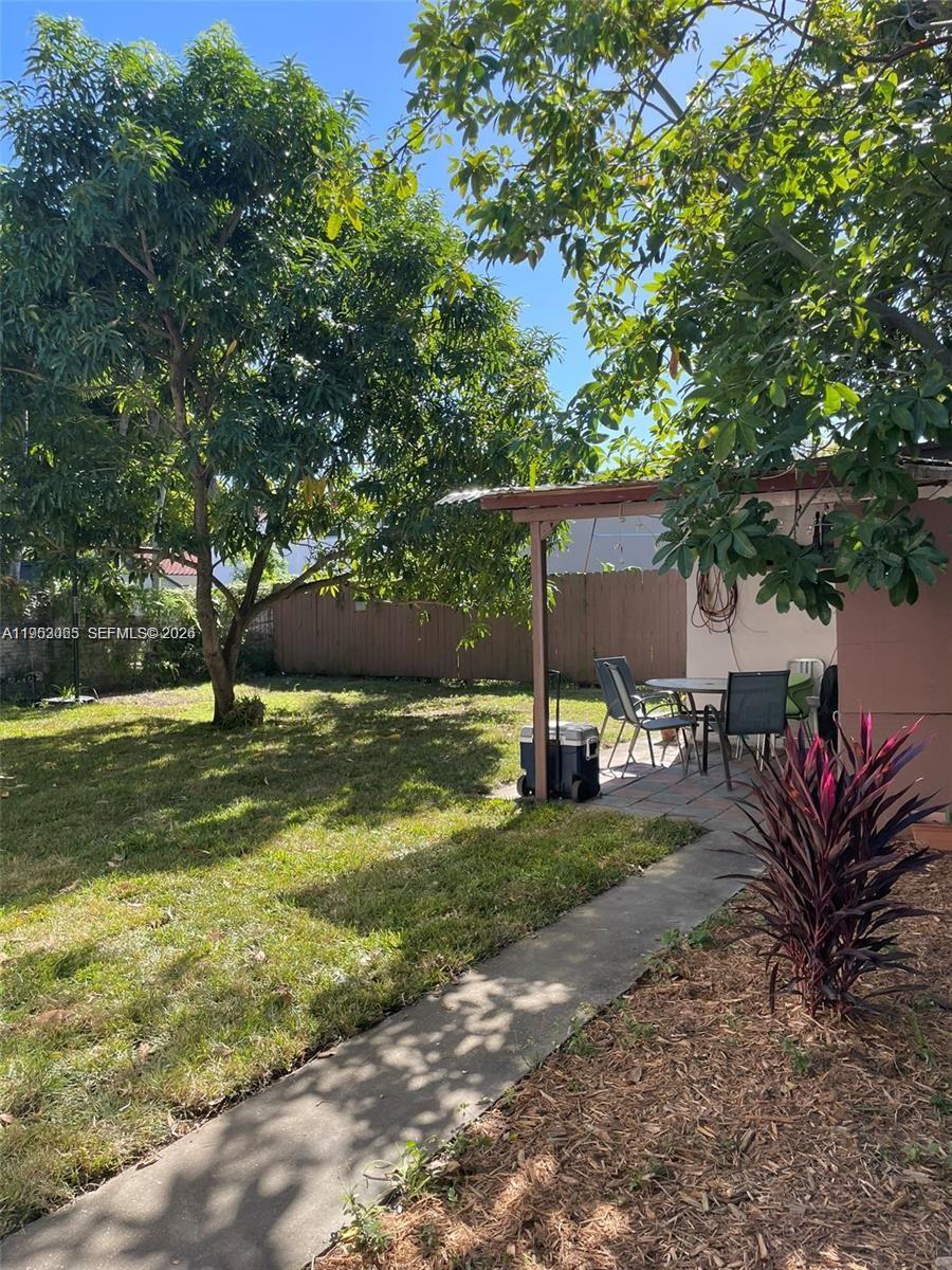 1790 Northwest 19th Street Miami, FL 33125 - Photo 6 of 6 a view of a house with backyard and sitting area