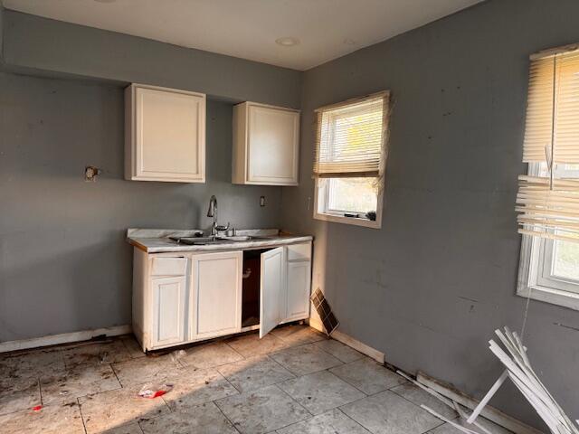 3608 Virginia Street Gary, IN 46409 - Photo 3 of 13 a utility room with granite countertop a sink a window and a washer