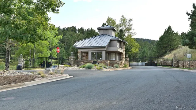 a front view of a house with porch and garden