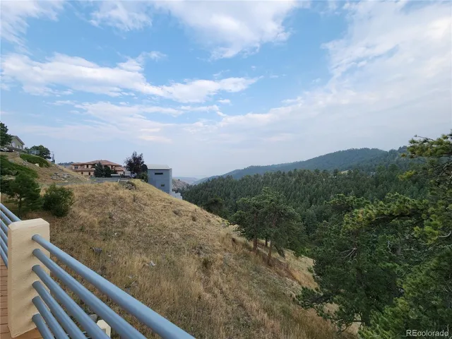 a view of a yard with a mountain