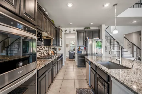 a kitchen with lots of counter space and a sink