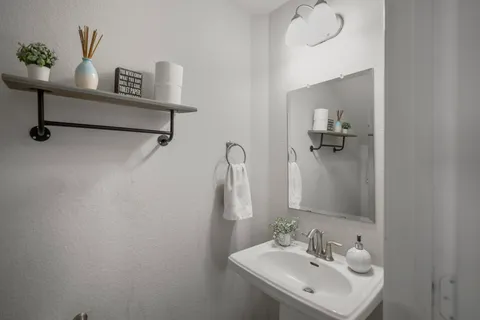a utility room with dryer washer and wall