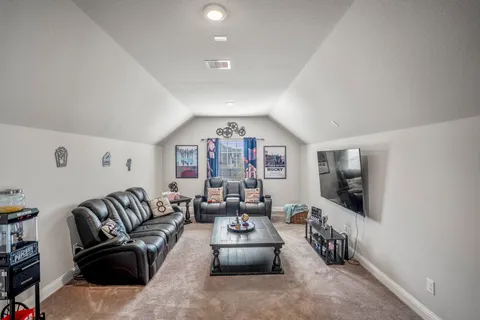 a view of kitchen with furniture and wooden floor
