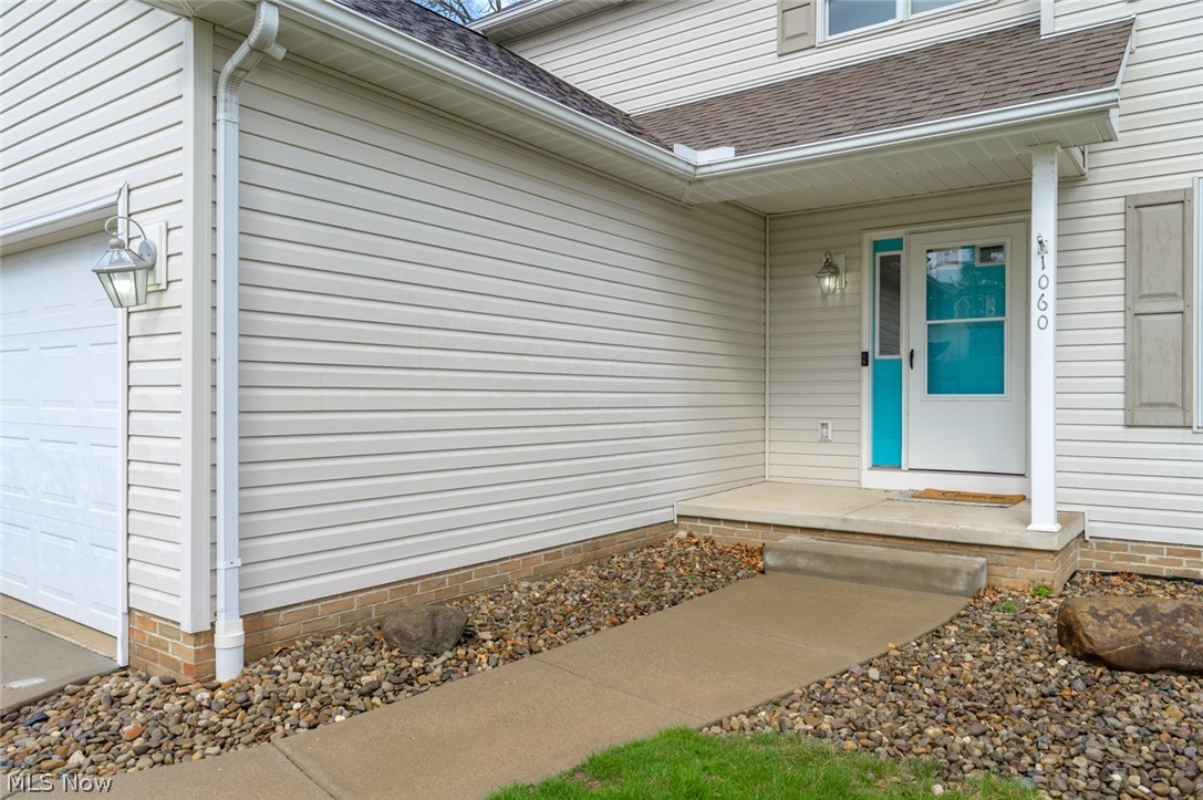 1060 Susan Road Ravenna, OH 44266 - Photo 2 of 25 Entrance to property with a garage and covered porch