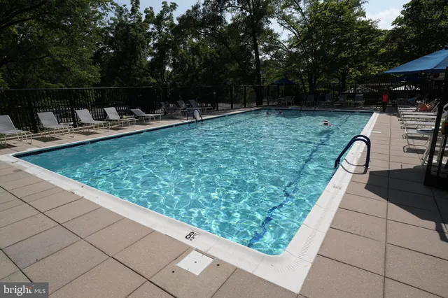 a view of a swimming pool with a patio