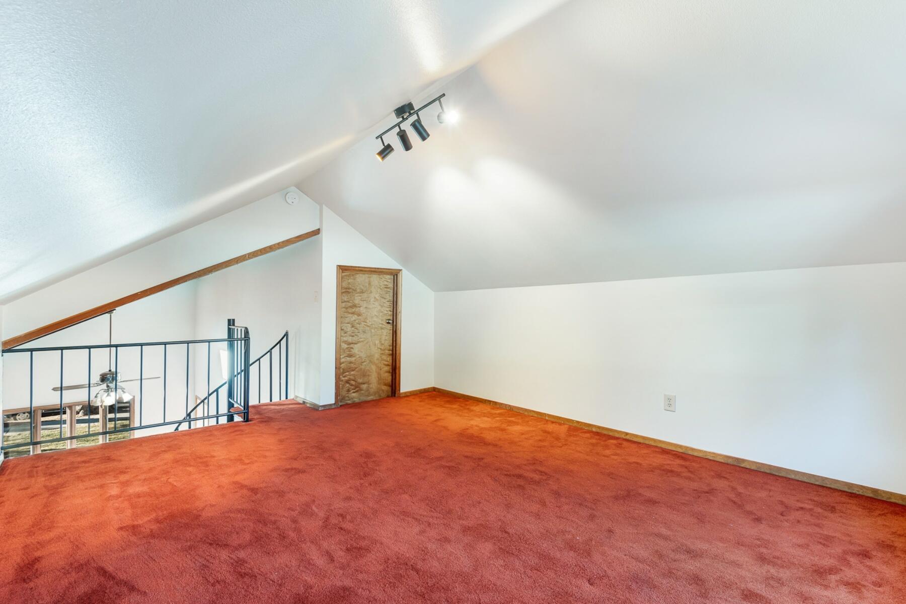 1588 Northwest Awbrey Road Bend, OR 97703 - Photo 17 of 28 an empty room with staircase and white walls