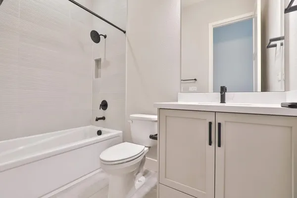 a utility room with cabinets washer and dryer