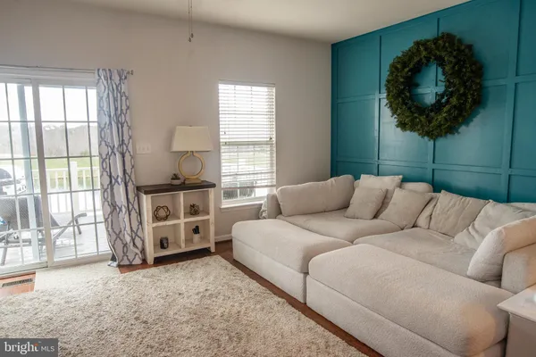 a view of a livingroom with furniture and windows
