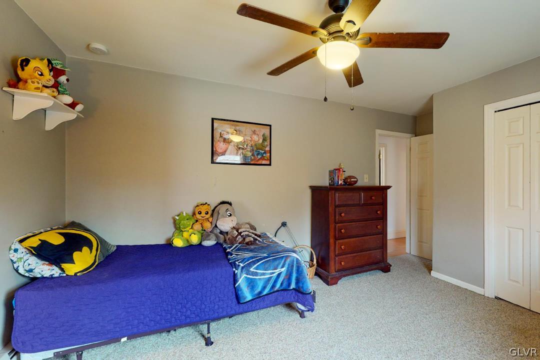 6158 Mud Run Road Nazareth, PA 18064 - Photo 41 of 50 a bedroom with a bed and a chandelier