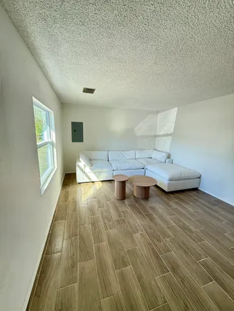 a living room with furniture and a rug