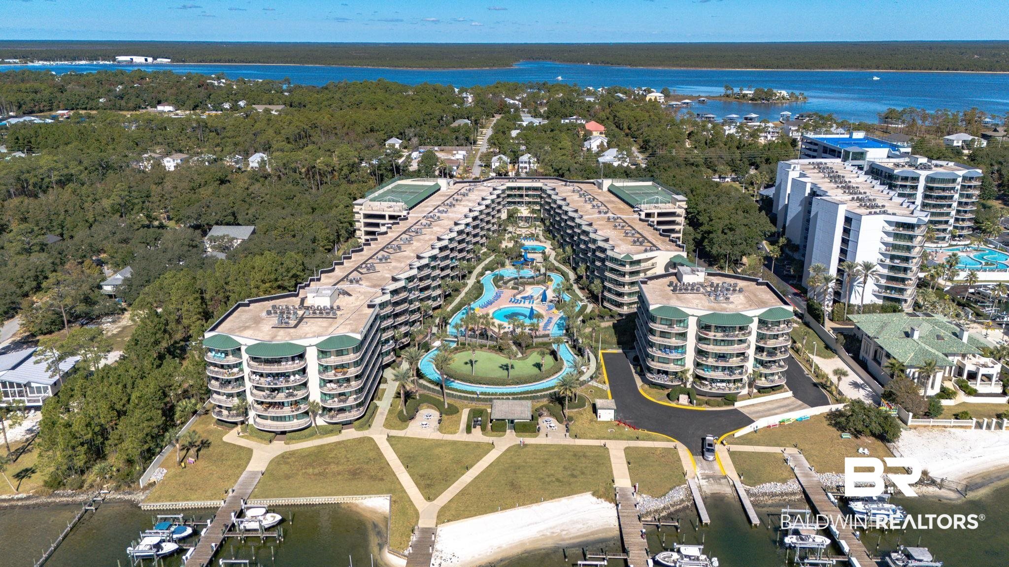 27580 Canal Road, Unit 1526 Orange Beach, AL 36561 - Photo 3 of 49 Aerial view of property's location featuring a large body of water and apartment complex / building