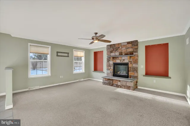 a view of a kitchen with a sink and a refrigerator