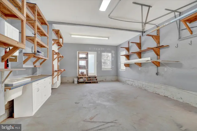 a large house with a large tree in front of it