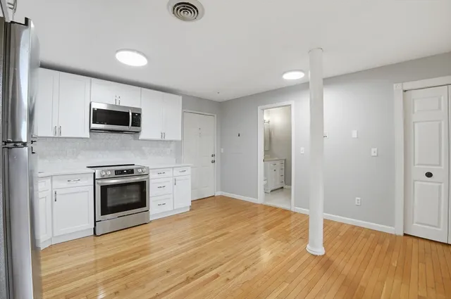 a kitchen with a stove and a microwave