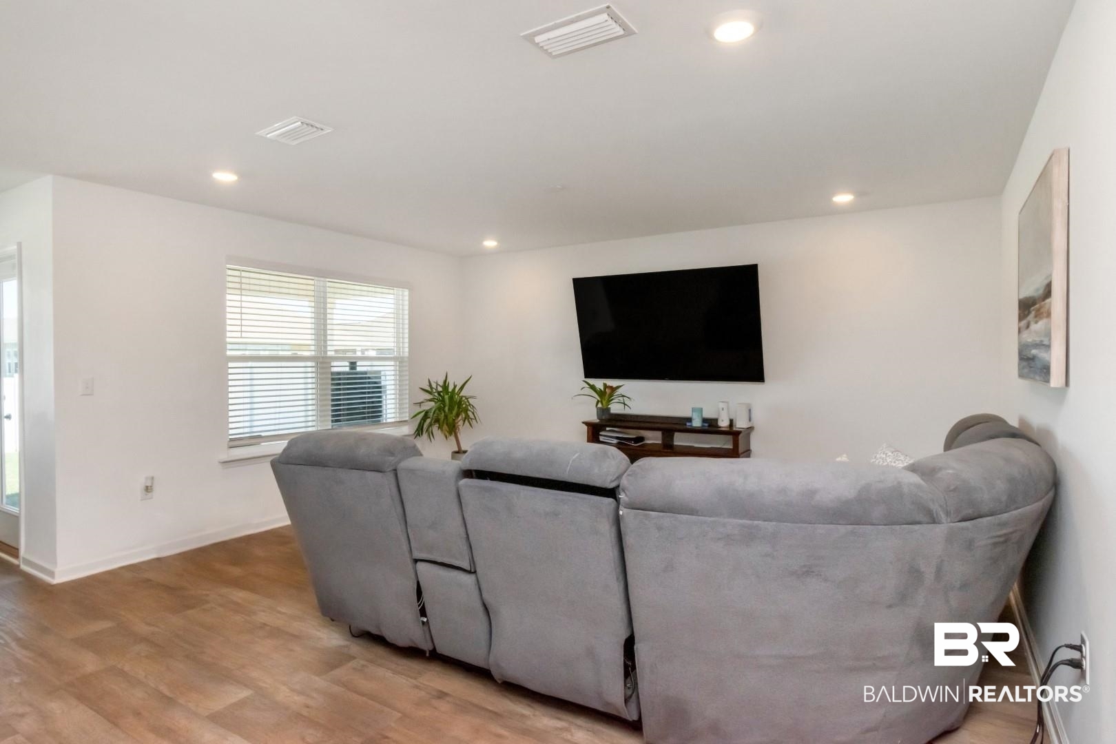 10921 Northern Dancer Court Daphne, AL 36526 - Photo 7 of 32 Living room featuring light hardwood / wood-style flooring