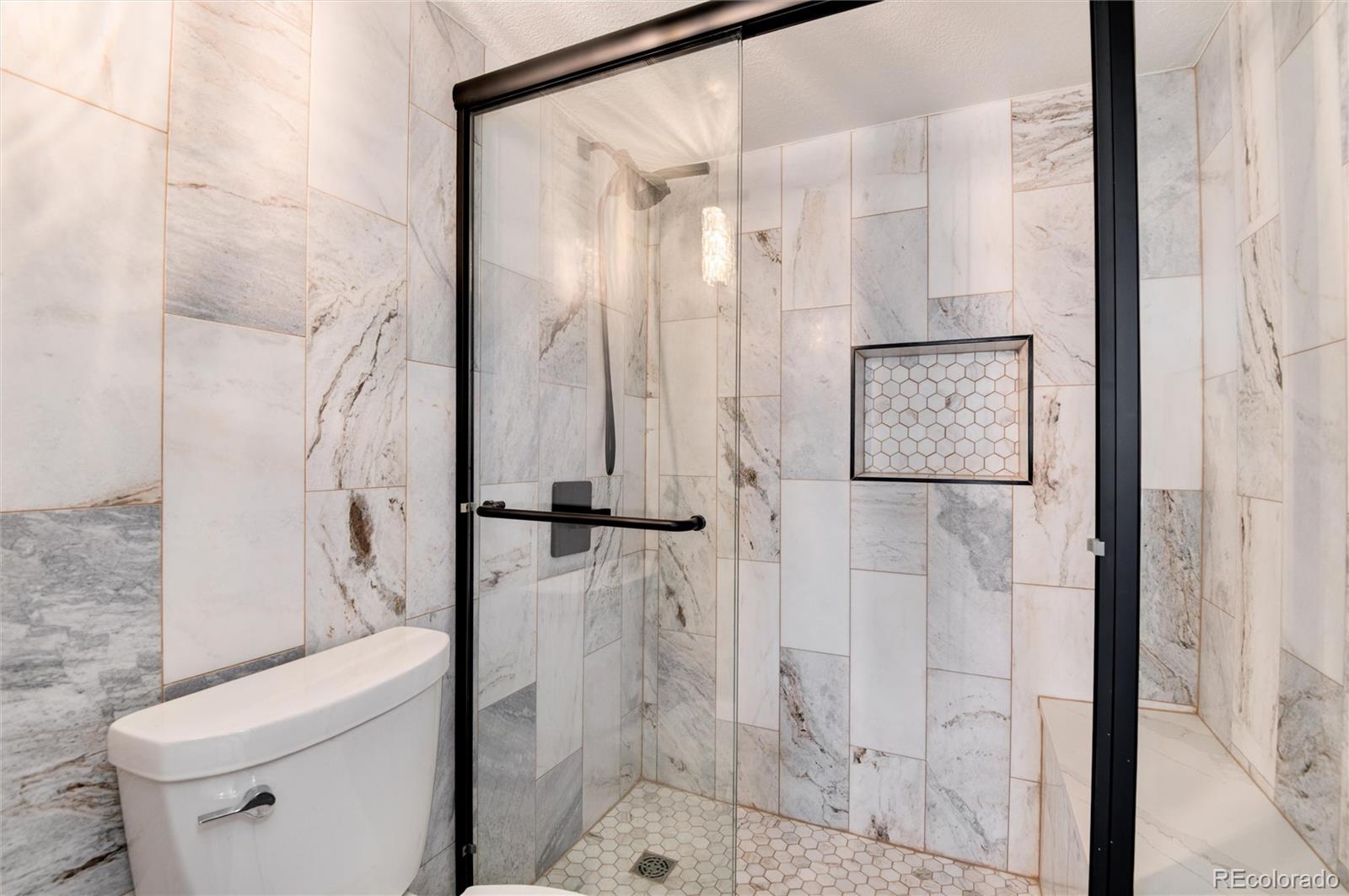 2 Adams Street, Unit 1504 Denver, CO 80206 - Photo 17 of 43 a bathroom with a shower and a toilet