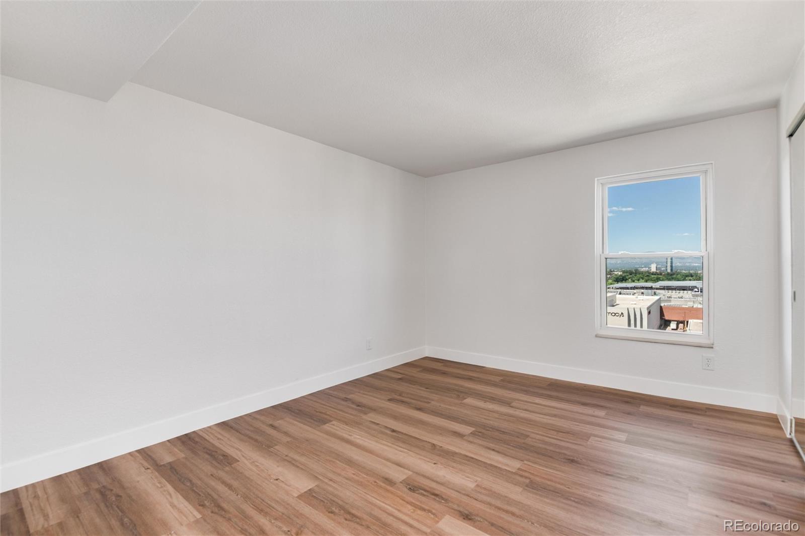 2 Adams Street, Unit 1504 Denver, CO 80206 - Photo 21 of 43 wooden floor in a room