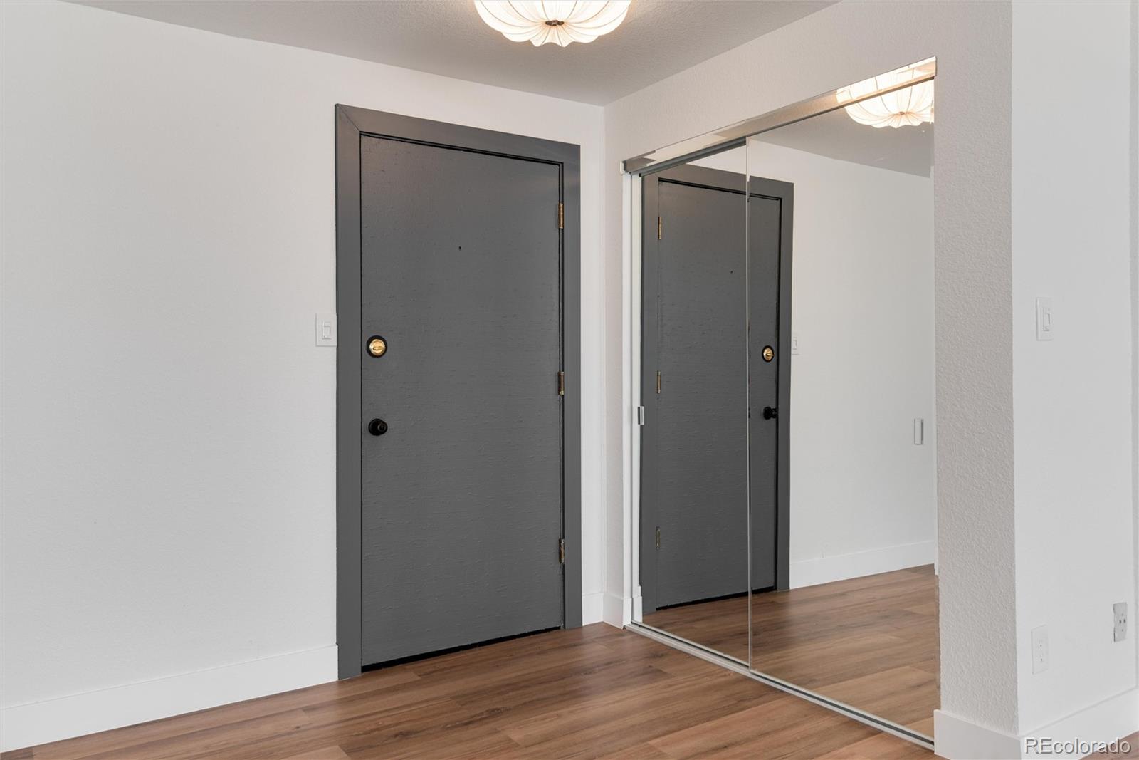 2 Adams Street, Unit 1504 Denver, CO 80206 - Photo 25 of 43 a view of an empty room with wooden floor