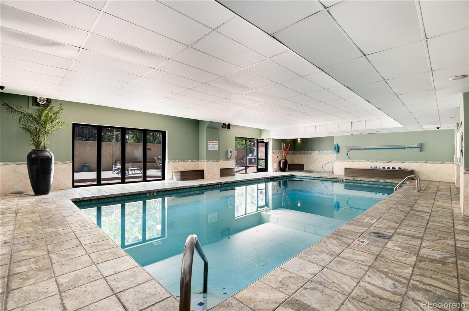 2 Adams Street, Unit 1504 Denver, CO 80206 - Photo 36 of 43 a view of a swimming pool and outdoor seating