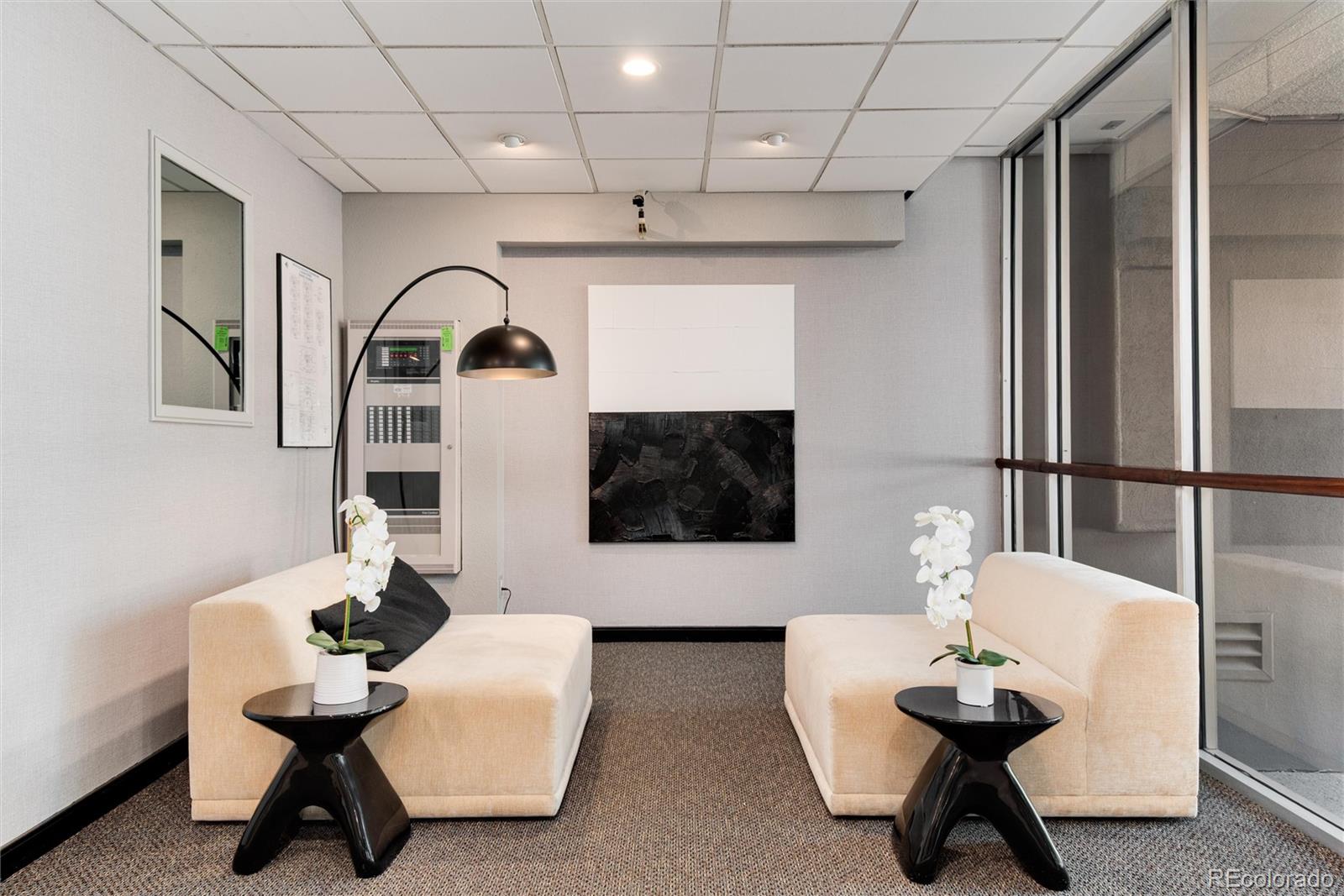 2 Adams Street, Unit 1504 Denver, CO 80206 - Photo 39 of 43 a living room with furniture and a flat screen tv