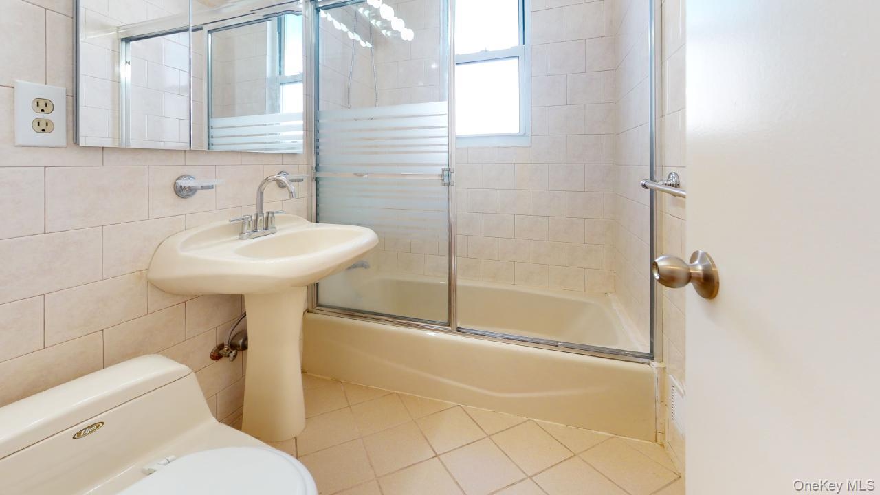 105-28 63rd Road, Unit 2 Queens, NY 11375 - Photo 28 of 30 a bathroom with a sink toilet and shower