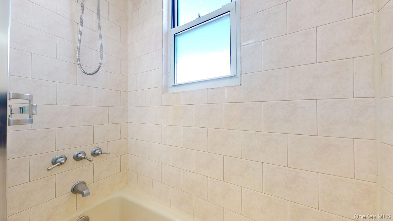 105-28 63rd Road, Unit 2 Queens, NY 11375 - Photo 29 of 30 a bathroom with a bathtub