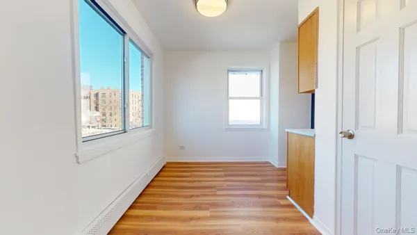 a bathroom with a window and a bathtub
