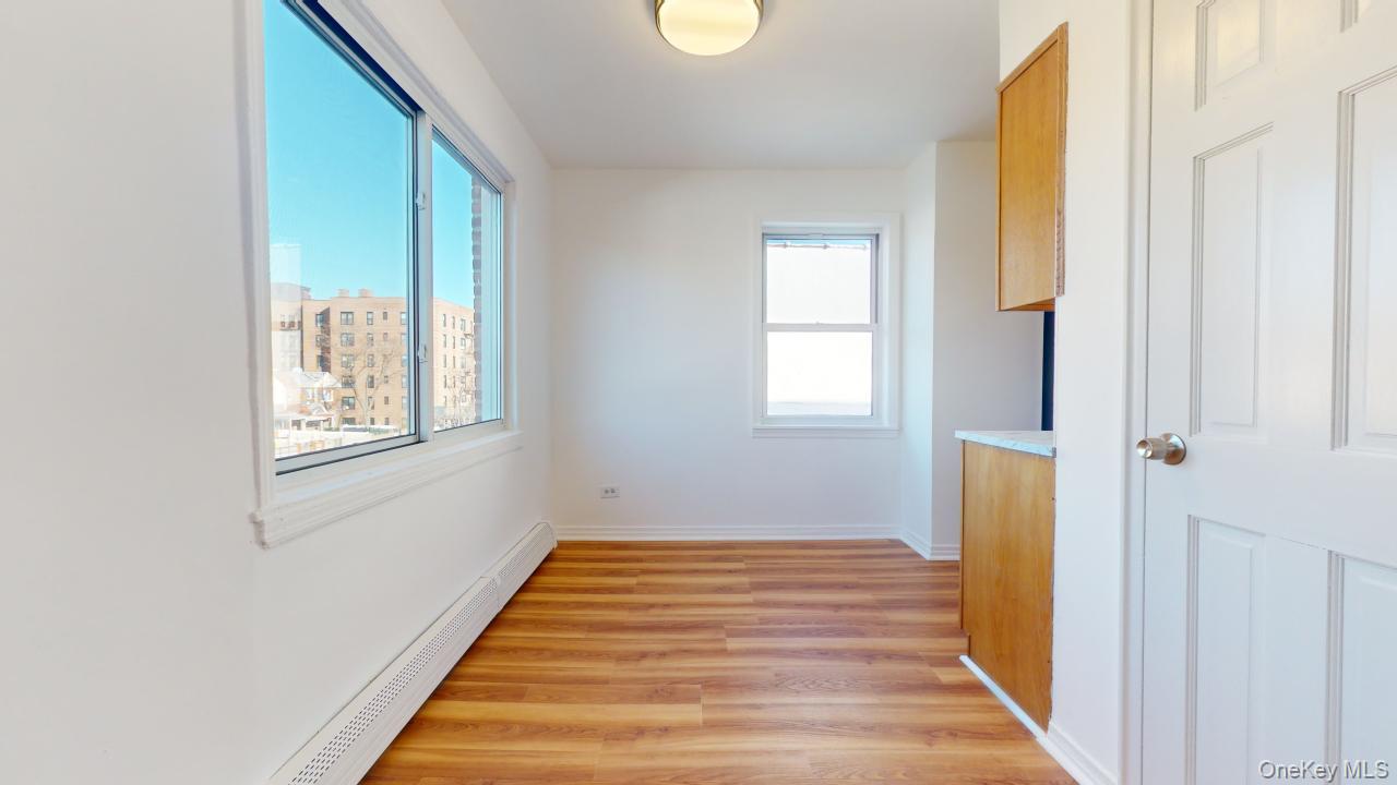 105-28 63rd Road, Unit 2 Queens, NY 11375 - Photo 9 of 30 a bathroom with a window and a bathtub
