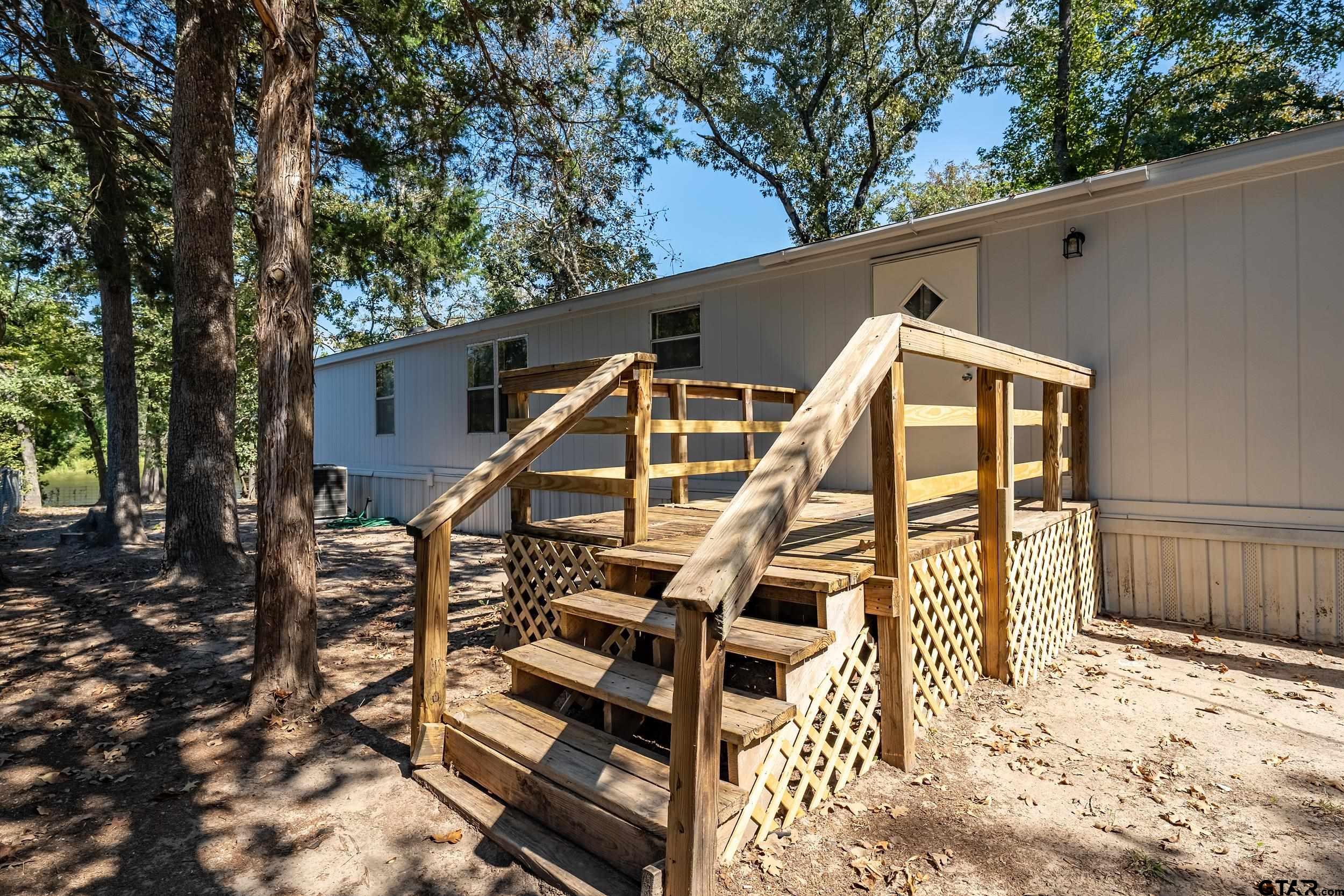 125 Ridgewood Lane Murchison, TX 75778 - Photo 26 of 46 a view of outdoor space yard and deck