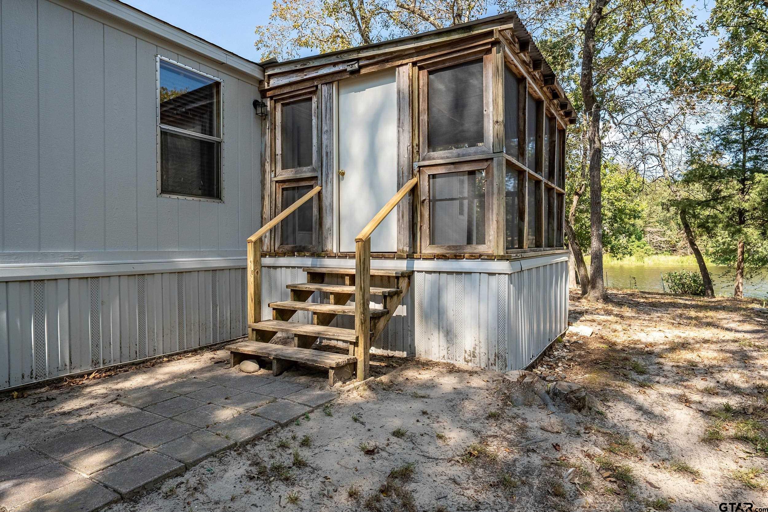 125 Ridgewood Lane Murchison, TX 75778 - Photo 33 of 46 a view of a house with wooden fence