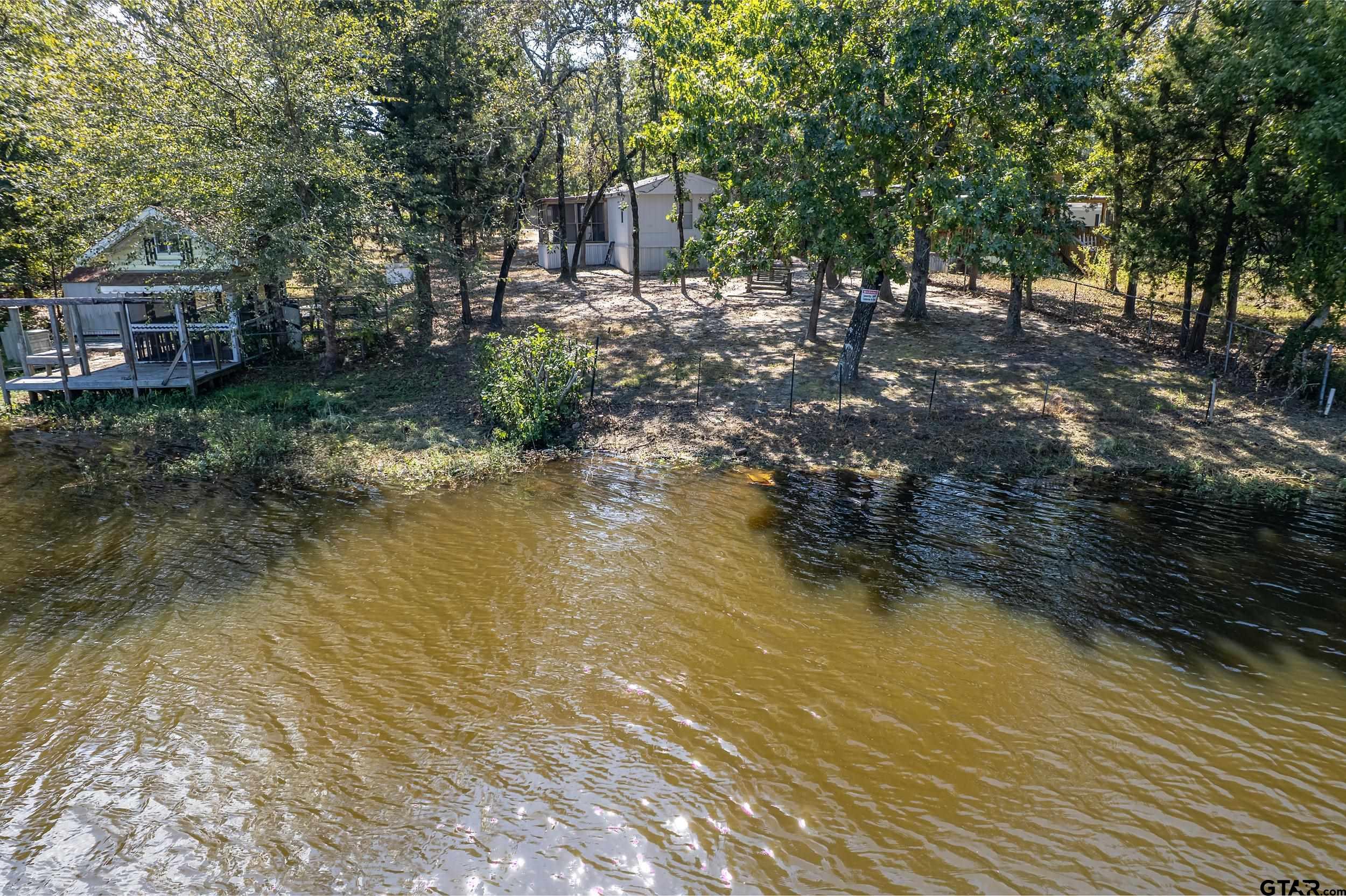 125 Ridgewood Lane Murchison, TX 75778 - Photo 46 of 46 a backyard of a house with lots of green space