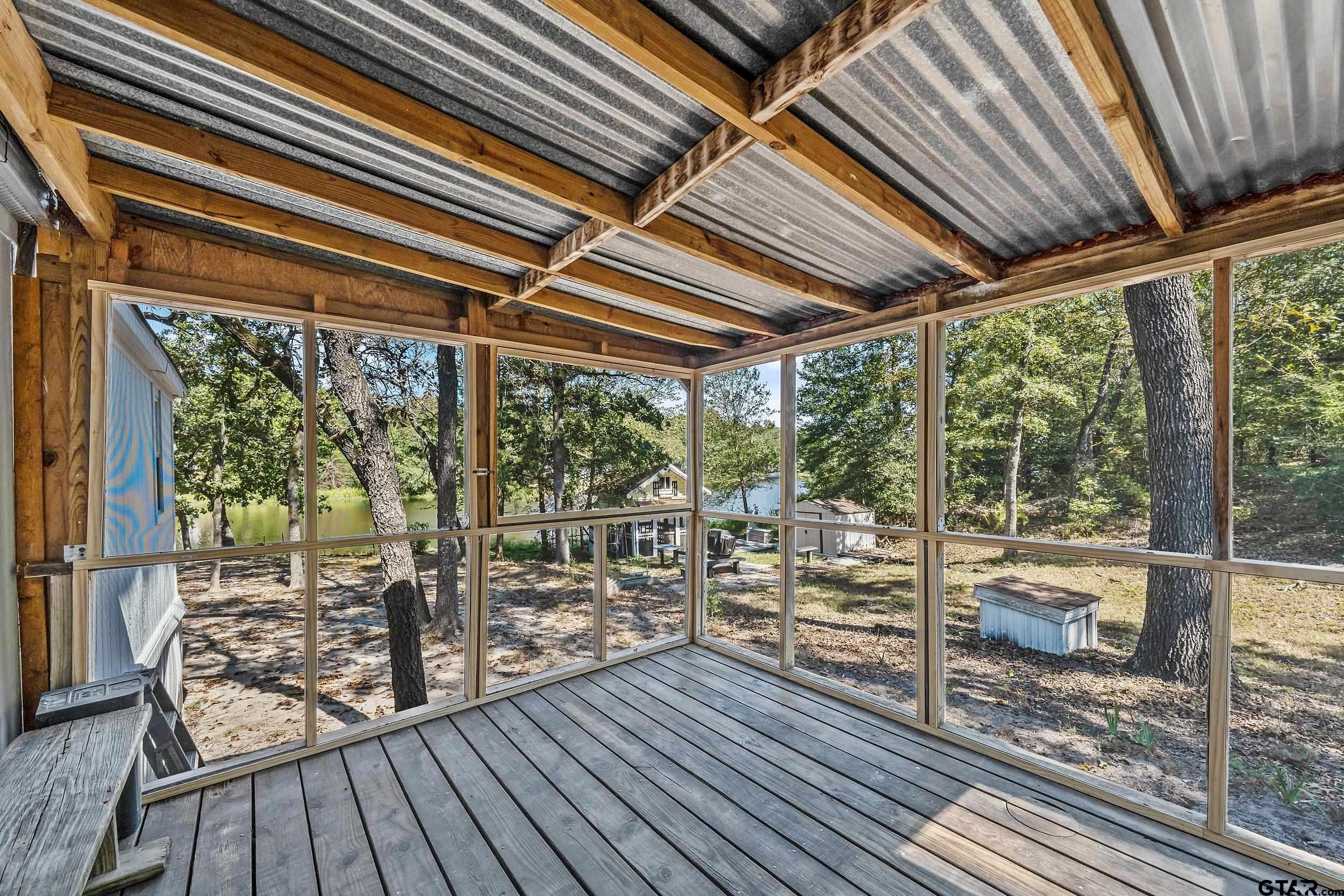 125 Ridgewood Lane Murchison, TX 75778 - Photo 7 of 46 a view of a room with wooden floor and city view