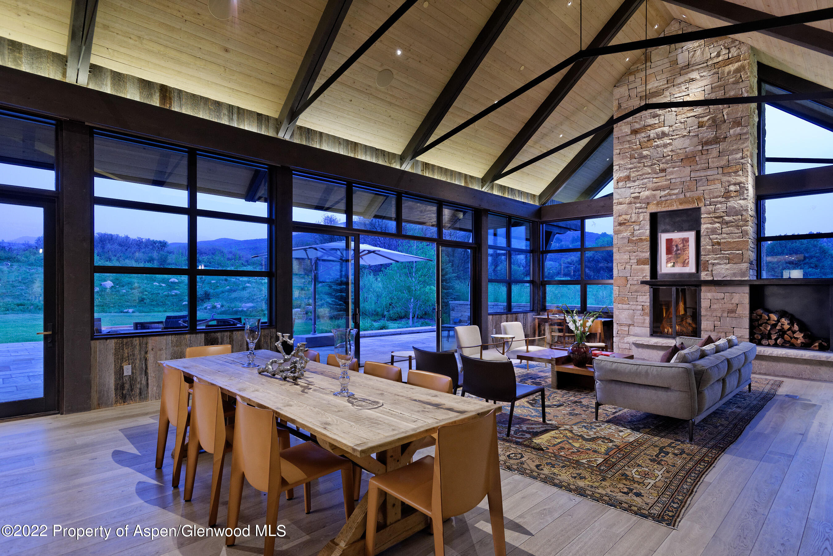 3500 Snowmass Creek Road Snowmass, CO 81654 - Photo 12 of 64 a outdoor dining space with furniture and wooden floor
