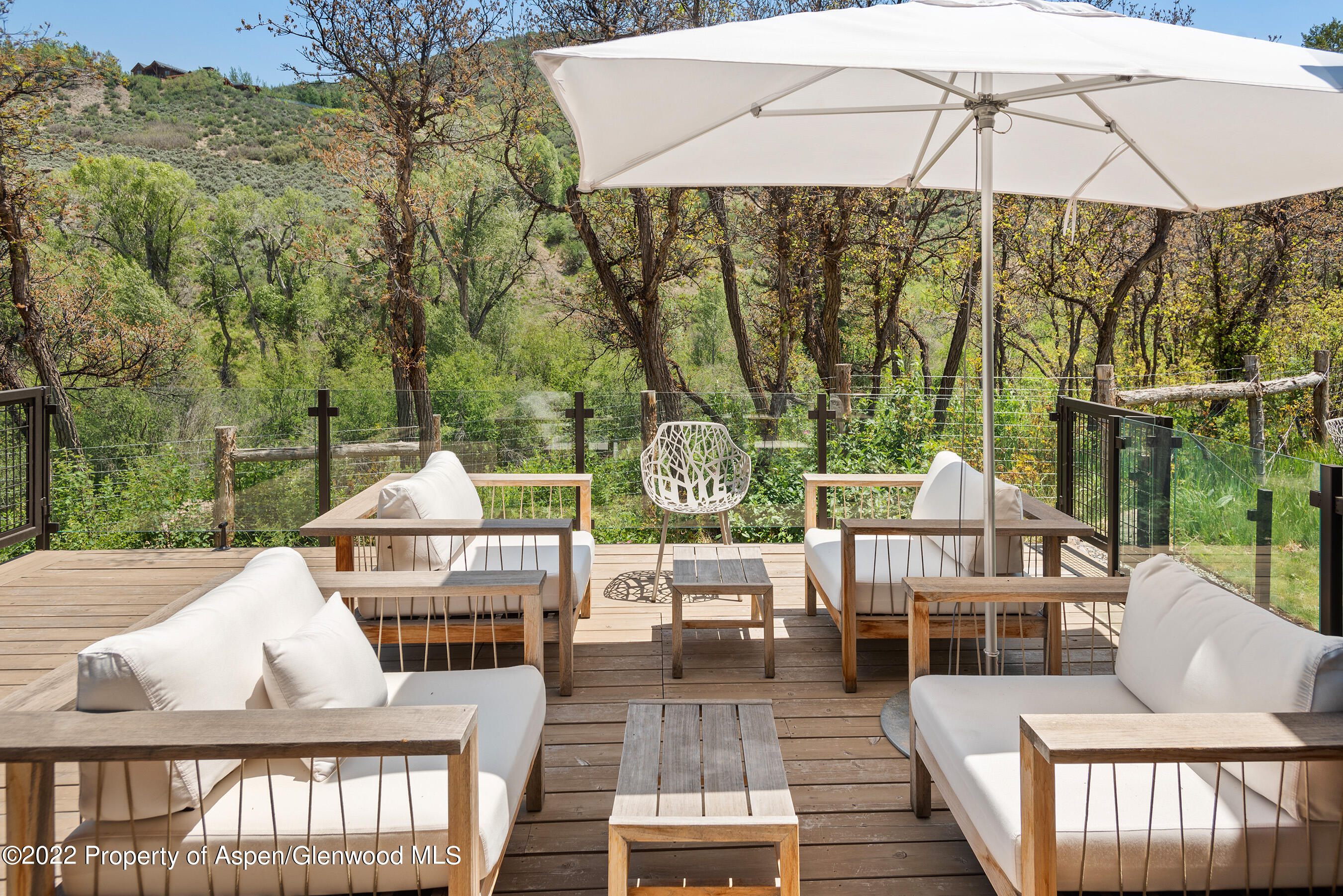 3500 Snowmass Creek Road Snowmass, CO 81654 - Photo 22 of 64 a view of deck with patio table and chairs