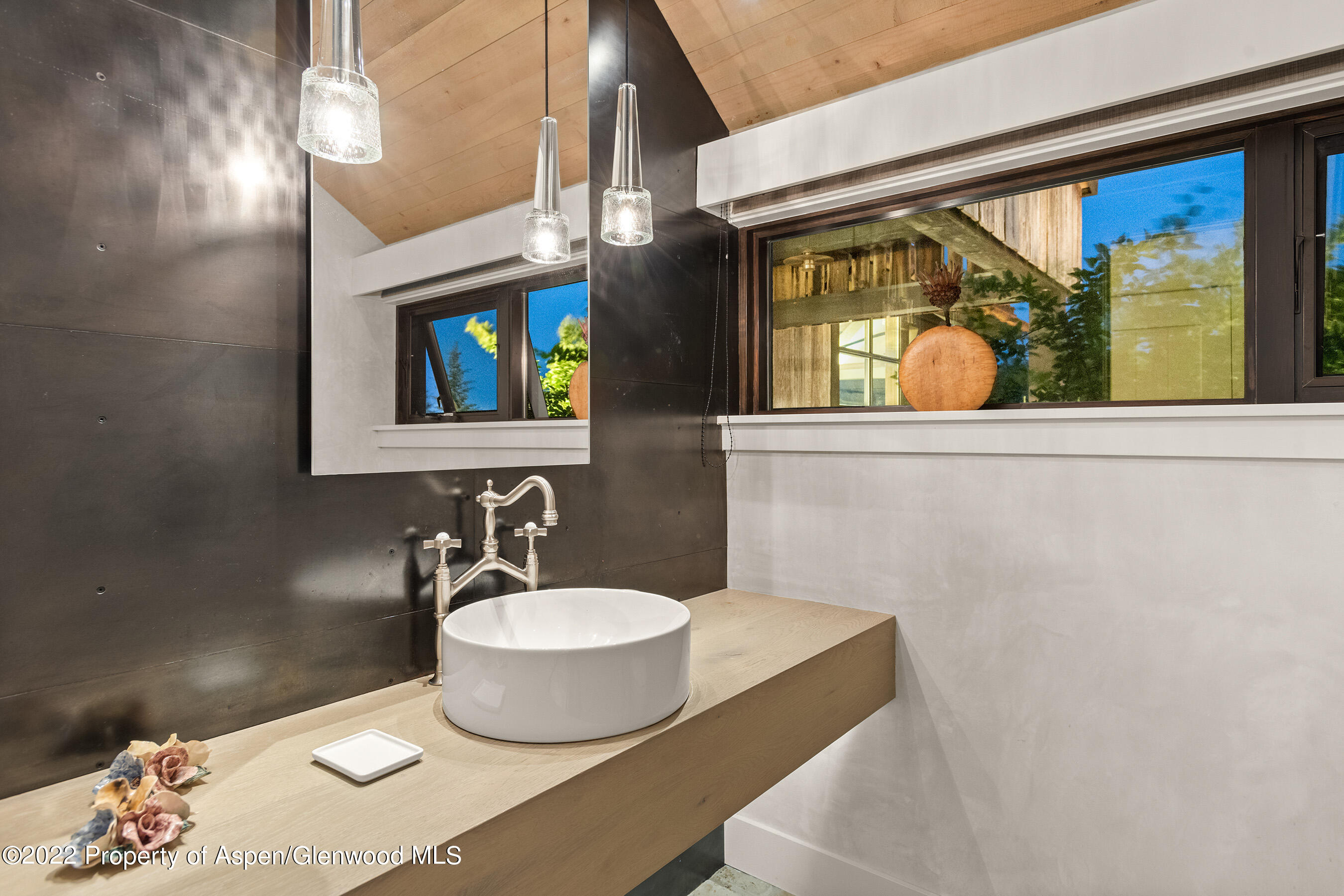 3500 Snowmass Creek Road Snowmass, CO 81654 - Photo 38 of 64 a bathroom with a sink and a mirror