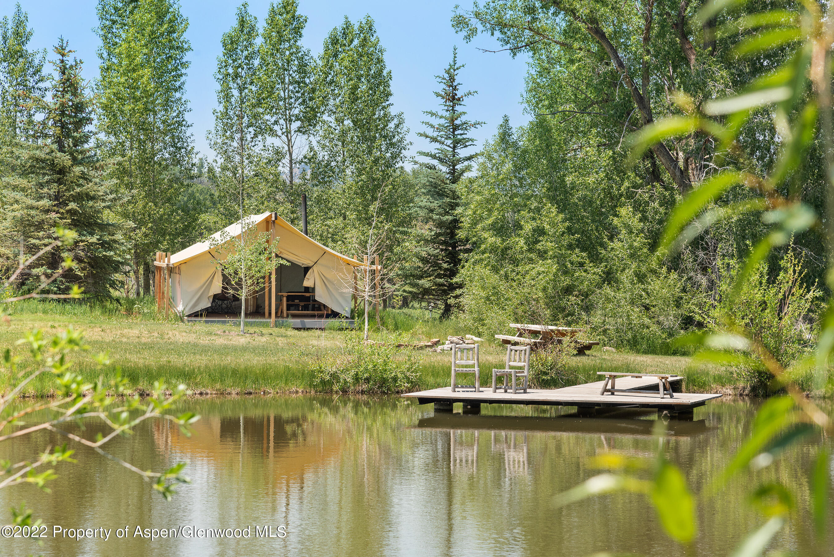 3500 Snowmass Creek Road Snowmass, CO 81654 - Photo 44 of 64 a view of a house with a yard