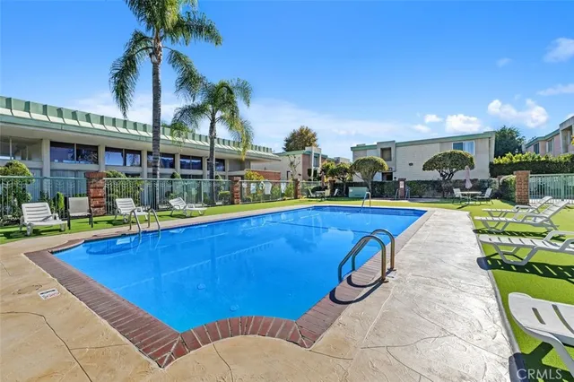 a view of swimming pool with outdoor seating