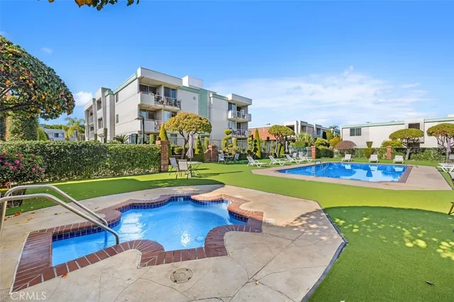 a view of a city with lawn chairs and a big yard