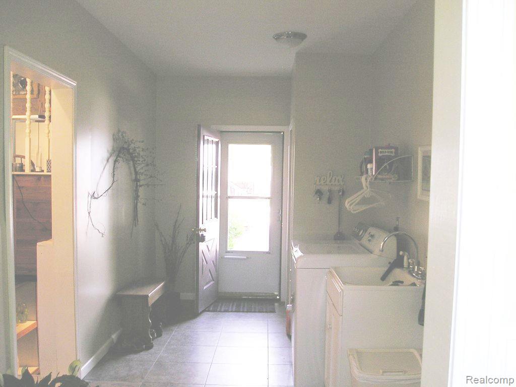 13845 Hough Road Allenton, MI 48002 - Photo 14 of 30 Entry foyer and laundry area. Entry way to kitchen on left.