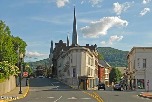 a view of a street in front of a building