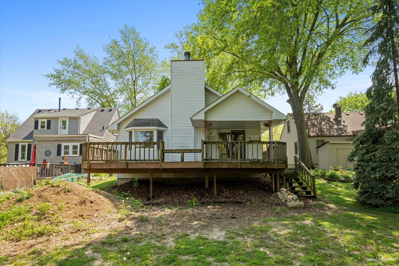 28W678 Warrenville Road Warrenville, IL 60555 - Photo 18 of 21 a view of a house with a yard